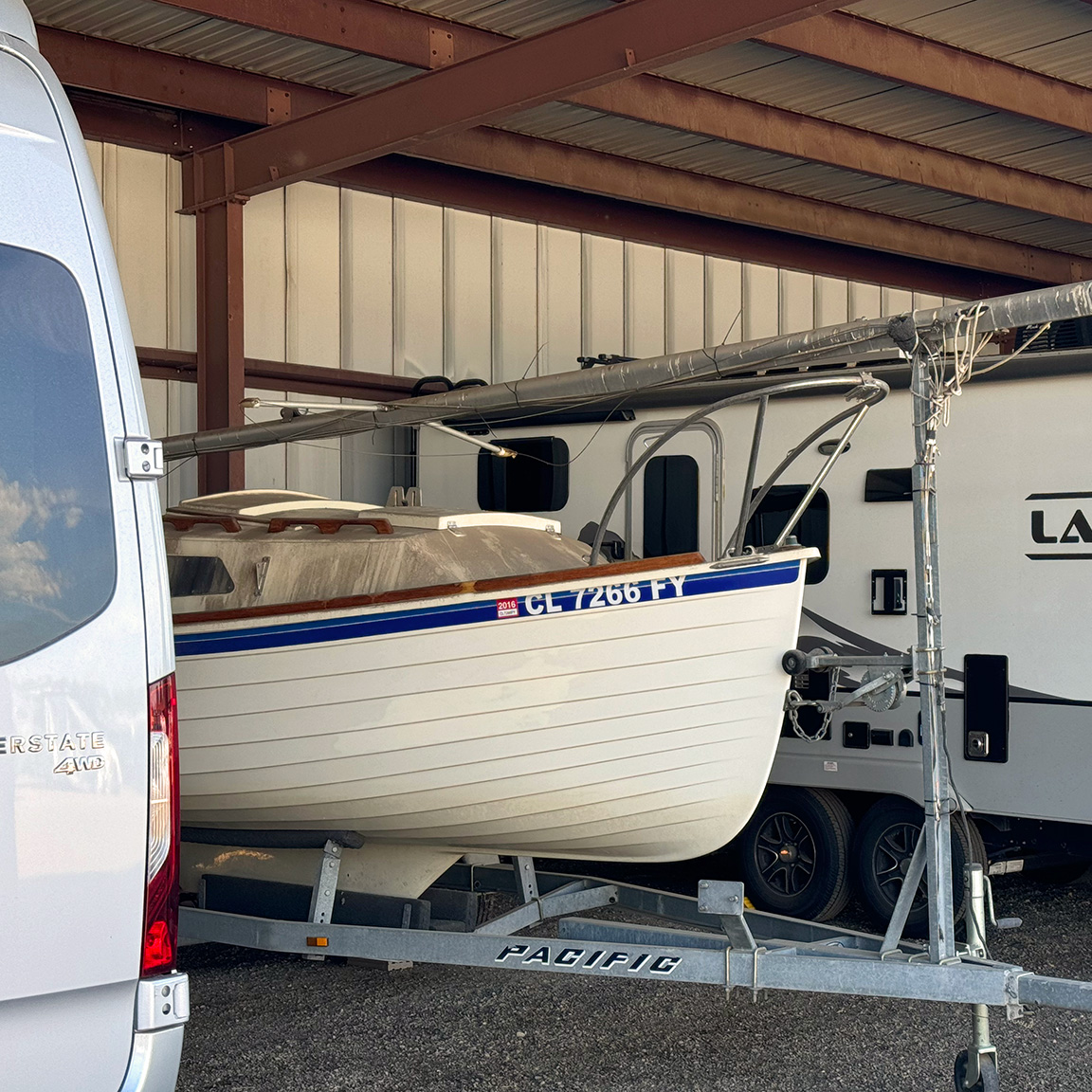 Boat parked in covered storage space.